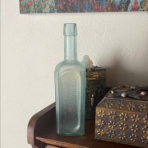Antique Aqua Glass Bottle with Embossed Text